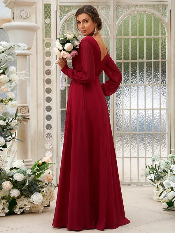 Back view of light blue A-line bridesmaid dress with long sleeves and ruched detail.