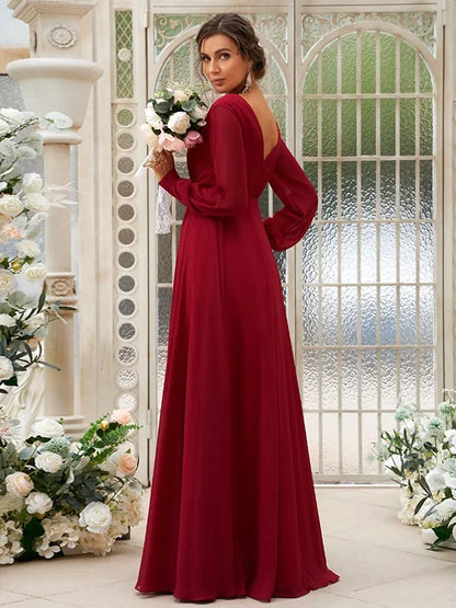 Back view of light blue A-line bridesmaid dress with long sleeves and ruched detail.