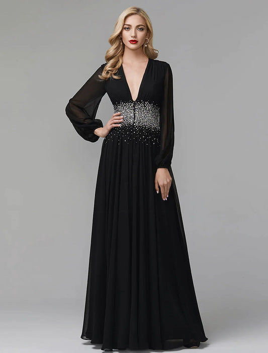 Model posing in a navy blue A-line sequin and chiffon evening gown.