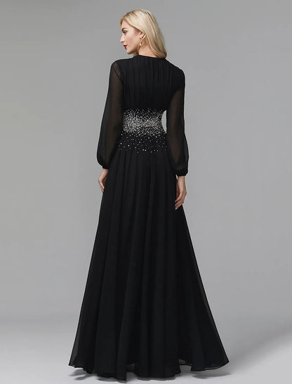 Full-length view of a model wearing an elegant navy blue sequin and chiffon formal dress.