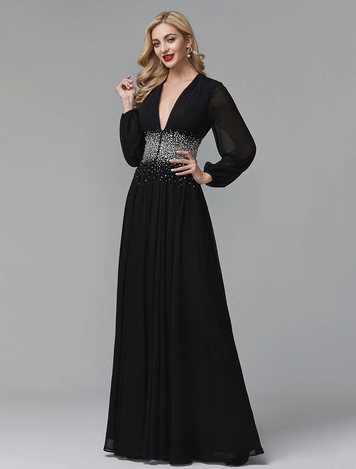 Back view of a model in a floor-length navy blue A-line sequin gown.