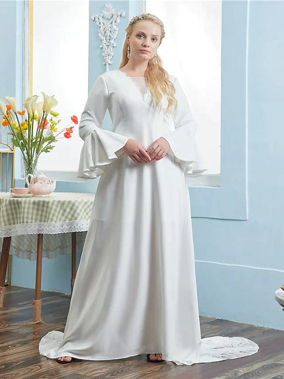Side view of a bride in an A-line long sleeve lace wedding dress.
