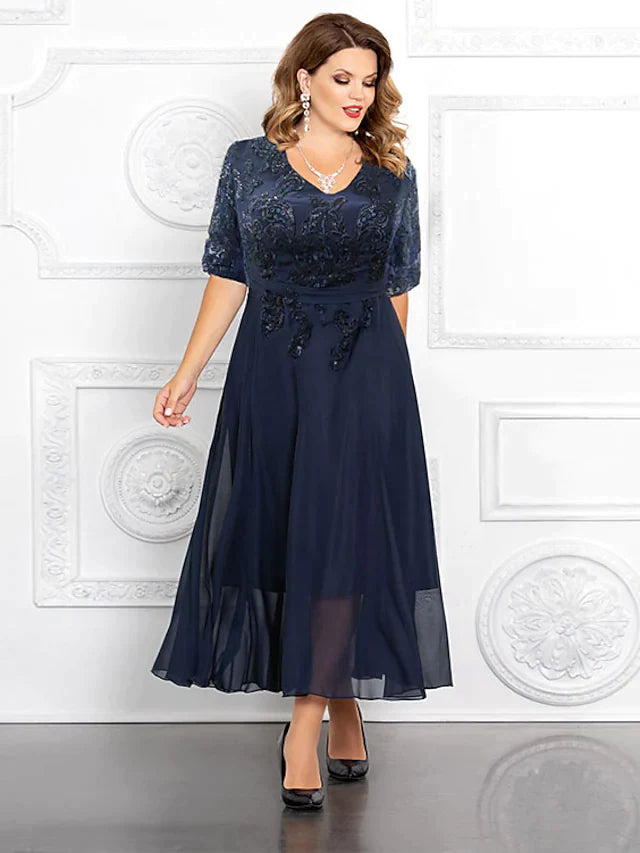 Plus size Mother of the Bride A-line V-neck gown in navy chiffon with sequins and half sleeves.