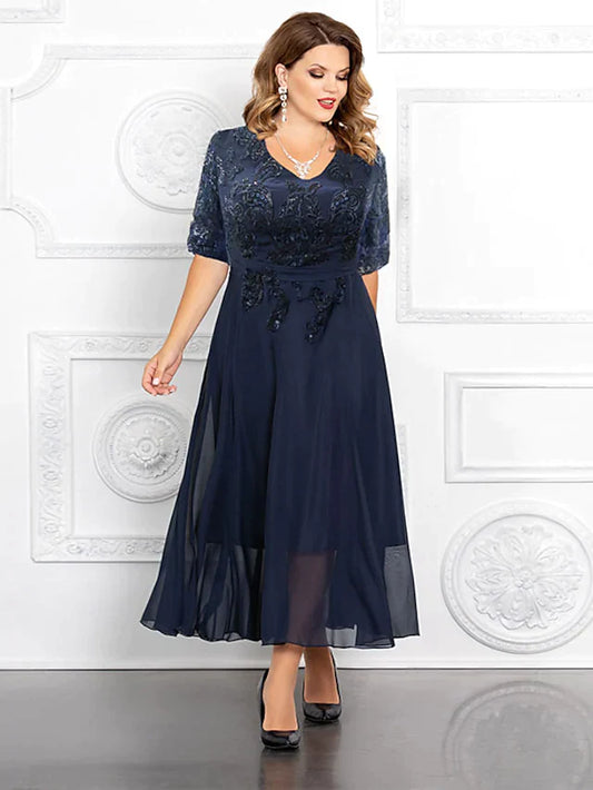Plus size Mother of the Bride A-line V-neck gown in navy chiffon with sequins and half sleeves.