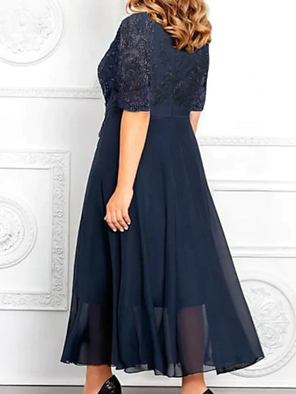 Elegant plus size A-line V-neck dress with sequined bodice and flowing chiffon skirt.