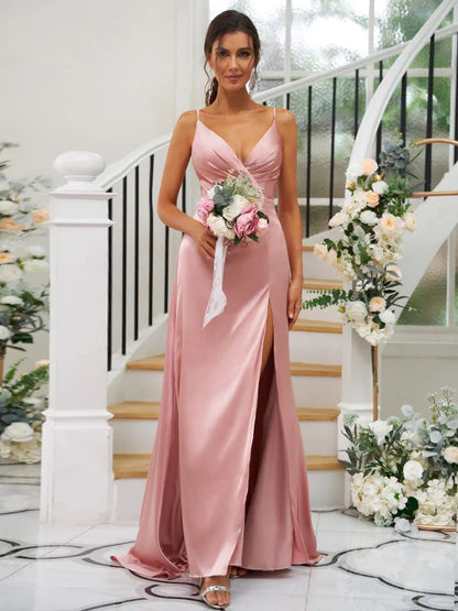Model in a pink A-line V-neck ruched bridesmaid dress.