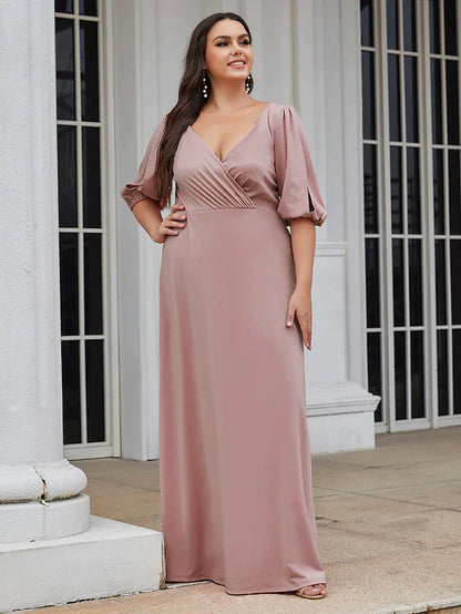 Model wearing a green A-line V-neck ruched stretch satin bridesmaid dress, front view.