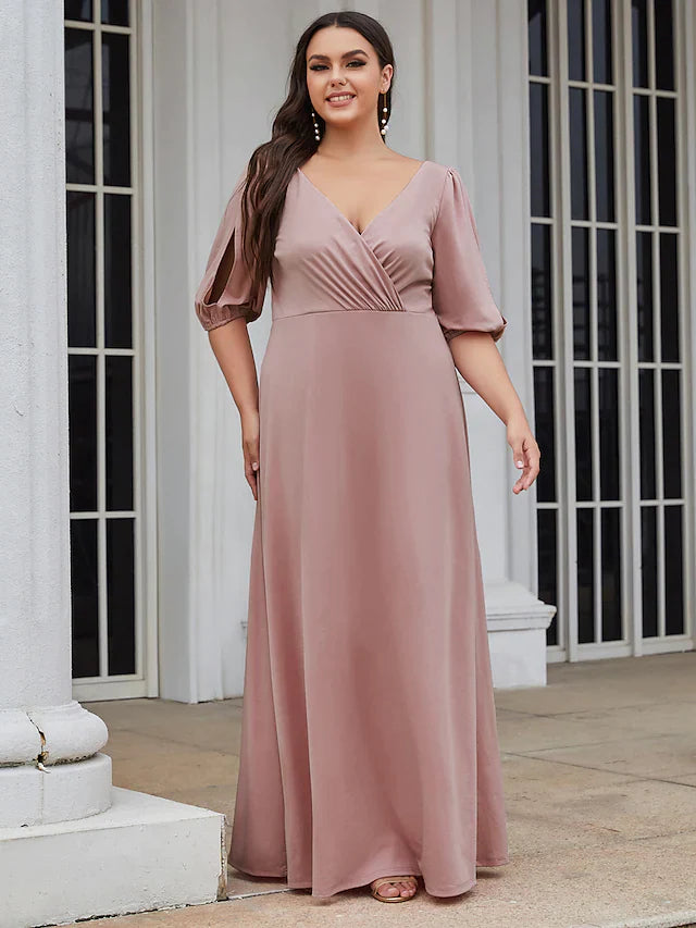 Model posing elegantly in a green A-line V-neck ruched stretch satin bridesmaid dress.