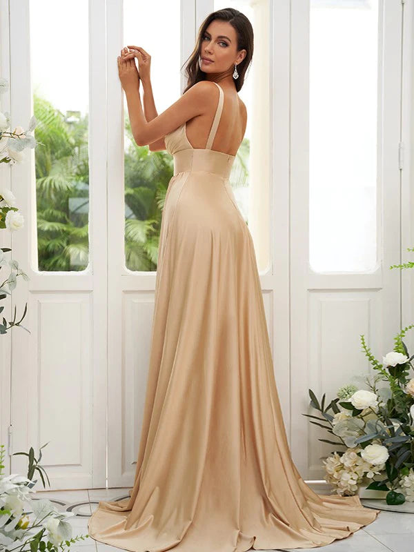 Side view of a woman in a pink A-line V-neck ruffled sleeveless jersey bridesmaid dress.