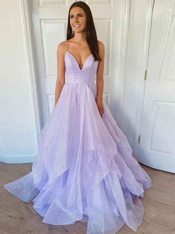 Woman wearing a light blue A-line V-neck ruffled prom dress.