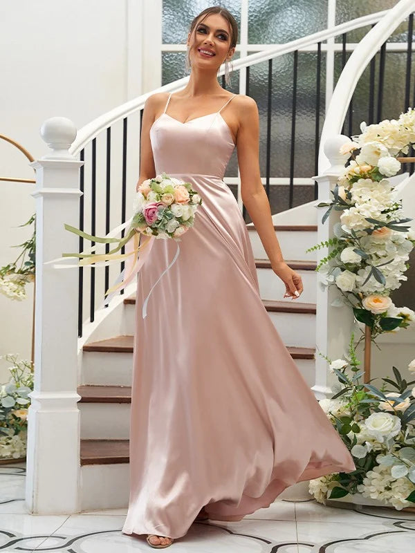 A woman wearing an elegant A-line V-neck ruffled bridesmaid dress in silk-like satin.