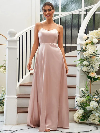 Full-length view of a woman posing in a sleeveless V-neck satin bridesmaid dress.