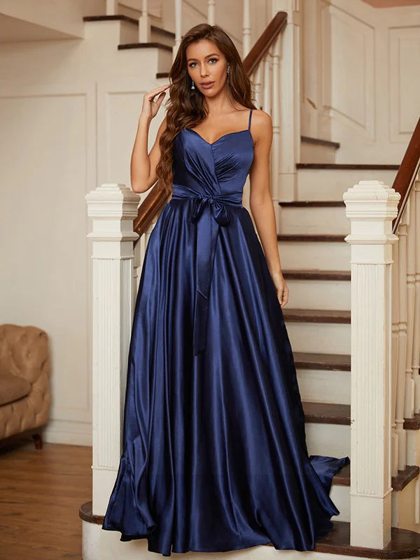Model wearing a light blue A-line V-neck ruffled prom dress.