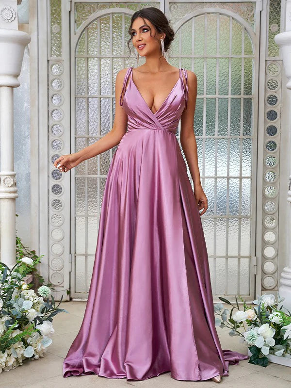 Full length view of an elegant A-Line V-neck ruffled bridesmaid dress in silk-like satin.