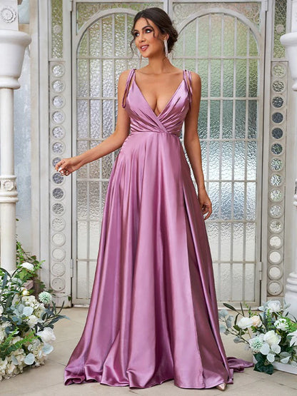 Full length view of an elegant A-Line V-neck ruffled bridesmaid dress in silk-like satin.