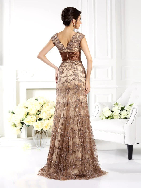 Side view of the long sleeveless A-Line lace dress with ruffles.