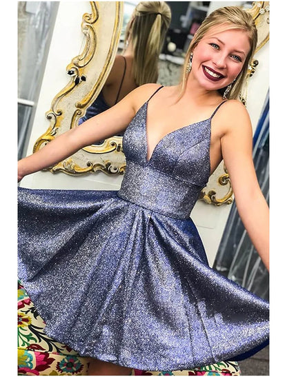 Model posing in a short A-line V-neck satin cocktail dress, front view.