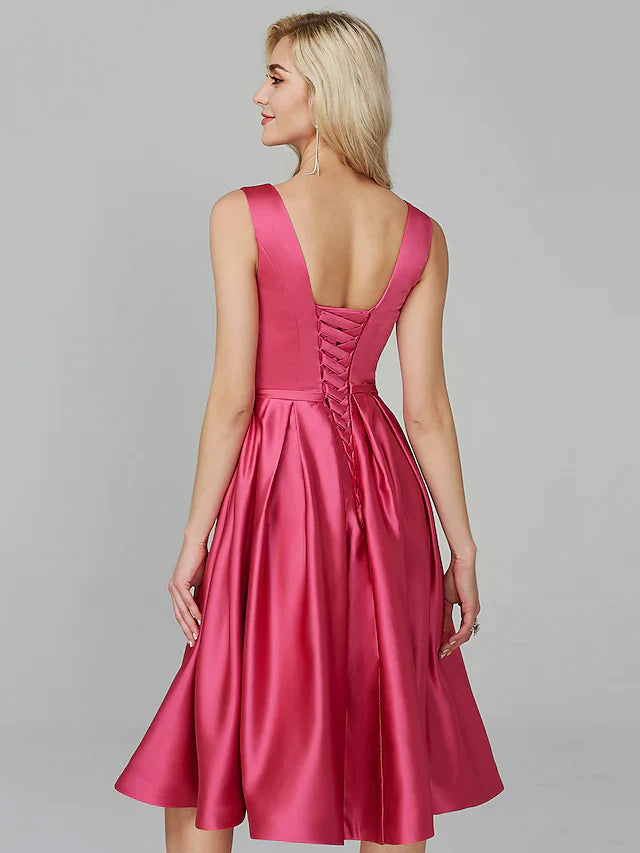 Back view of a woman in a red A-line satin dress, showcasing the elegant silhouette.