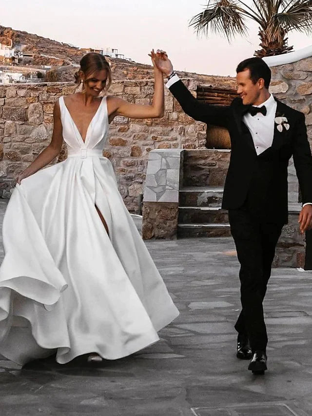 Close-up of V-neckline and satin fabric on wedding gown.
