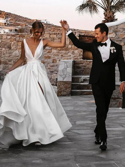 Close-up of V-neckline and satin fabric on wedding gown.