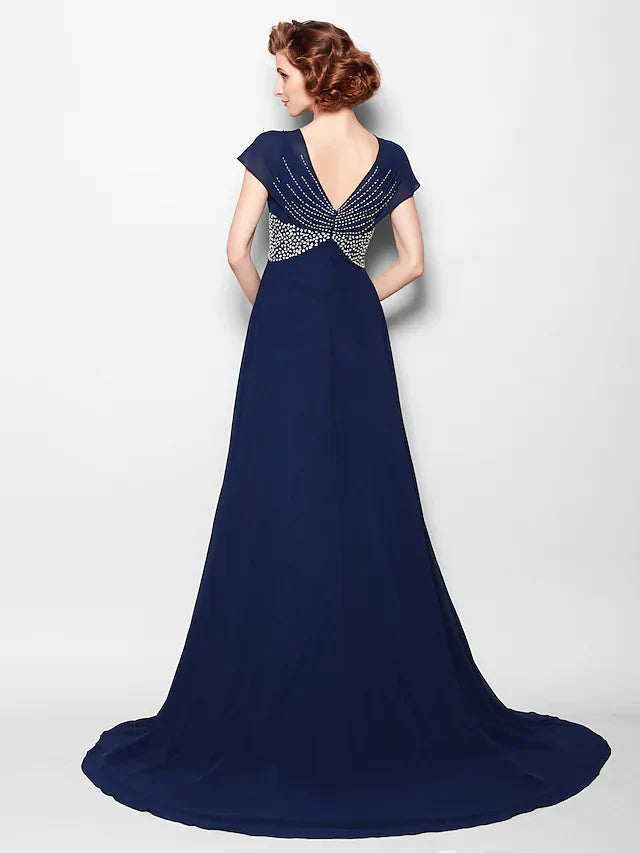 Close-up of the V-neckline and short sleeves, featuring intricate beading and sequins.