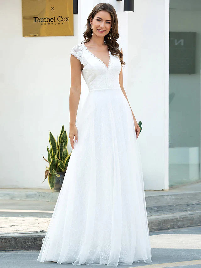 Full view of an elegant A-line V-neck short sleeve lace tulle wedding dress.