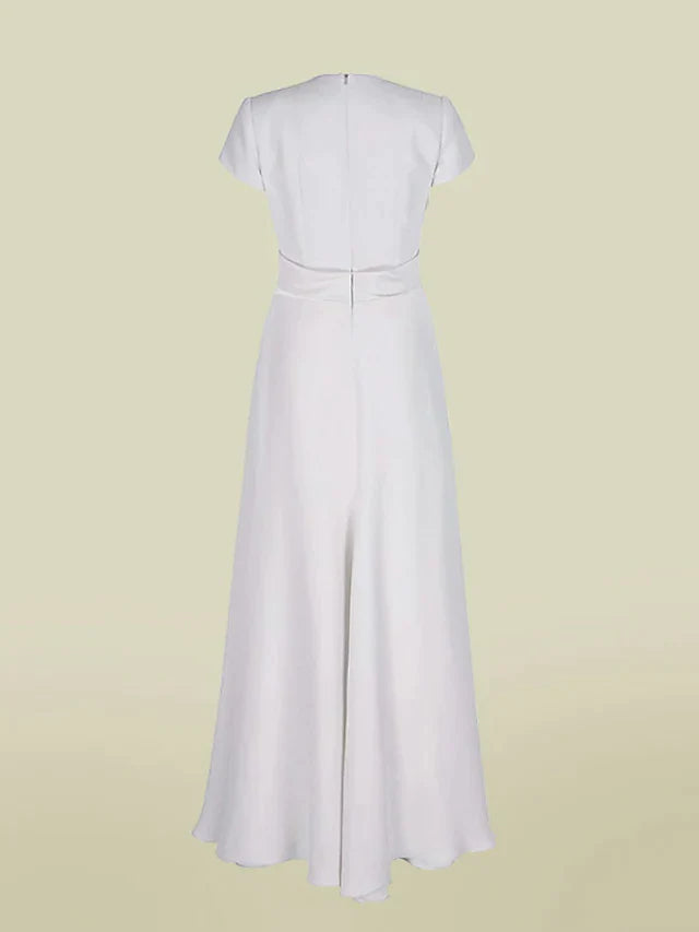 Side view of a flowing A-line charmeuse dress with short sleeves and pleats.