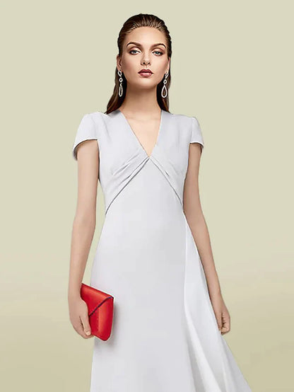 Back view of a floor-length Mother of the Bride gown with a V-neck and short sleeves.