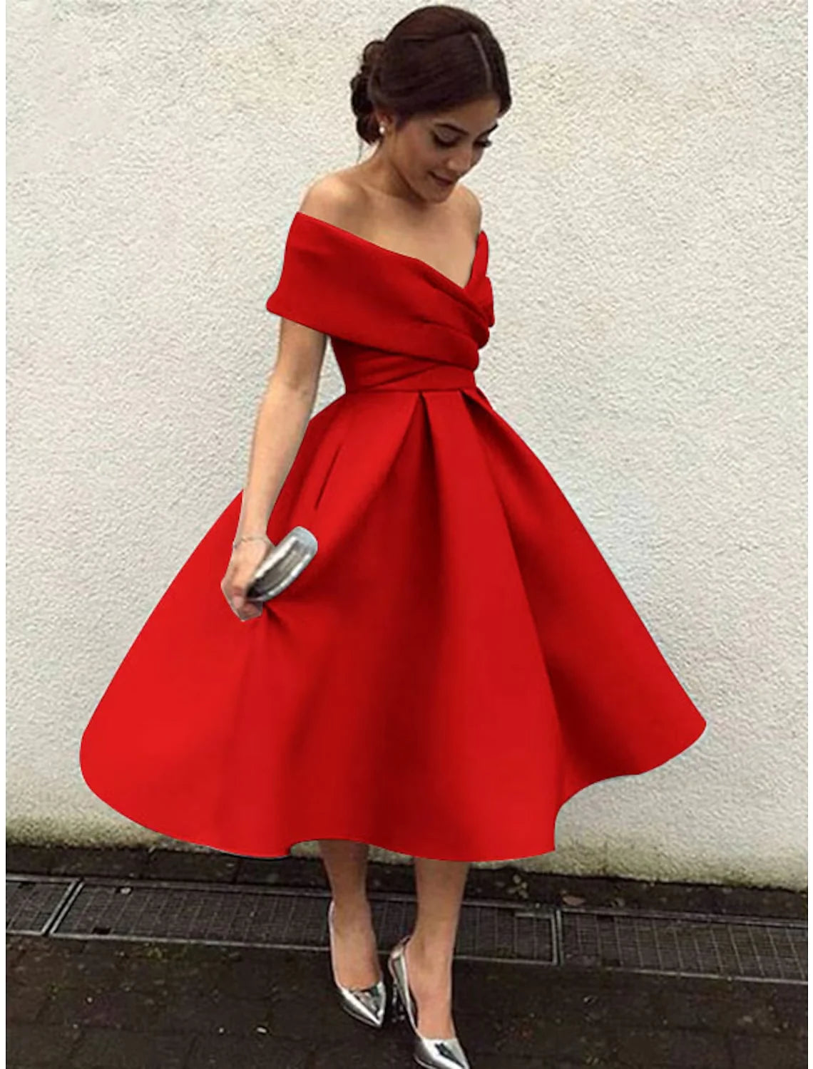Woman posing in a vibrant red A-line V-neck short sleeve tea length party dress.