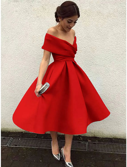 Woman posing in a vibrant red A-line V-neck short sleeve tea length party dress.
