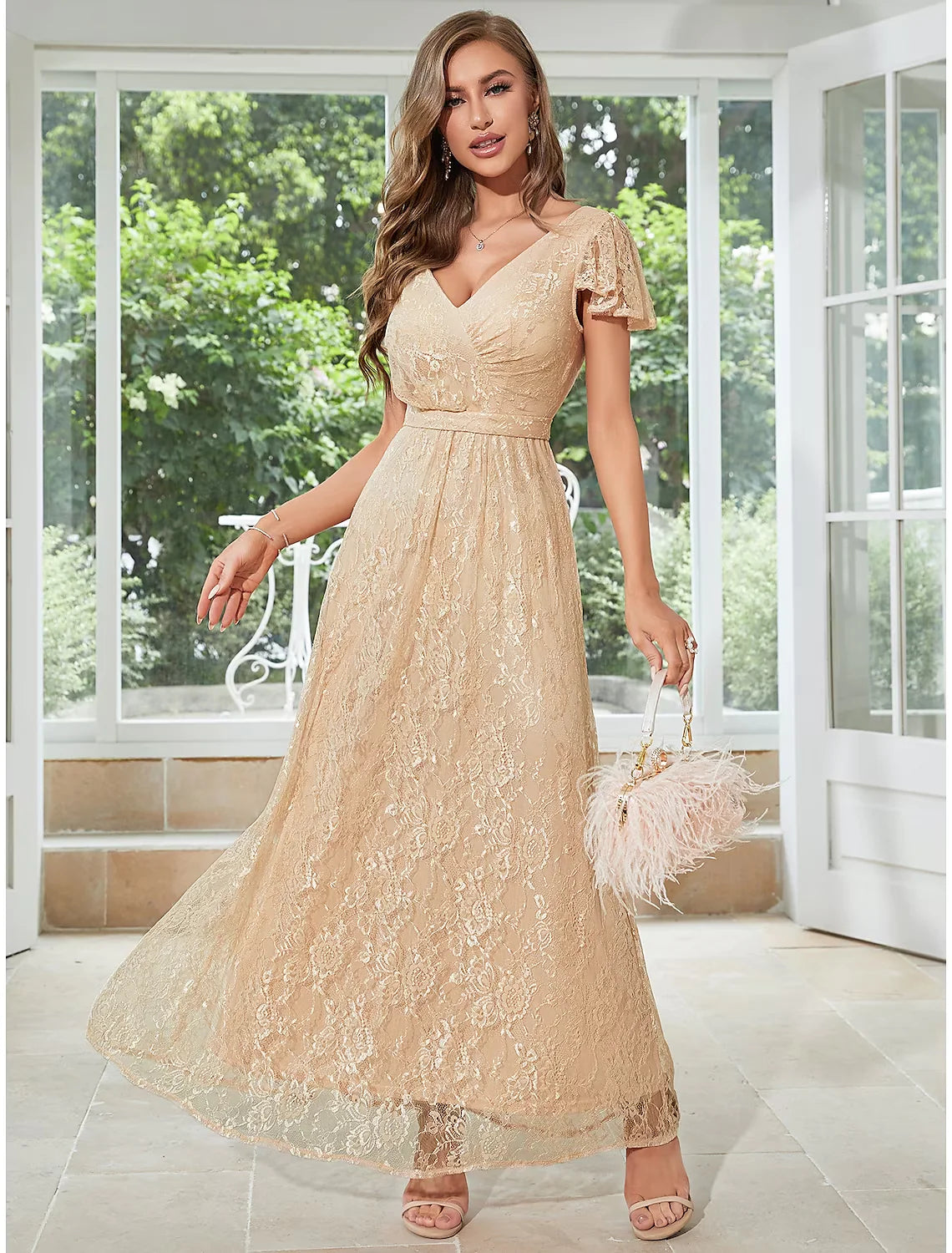 Full-length view of an elegant A-line chiffon dress with V-neck, short sleeves, and ruffled hem.