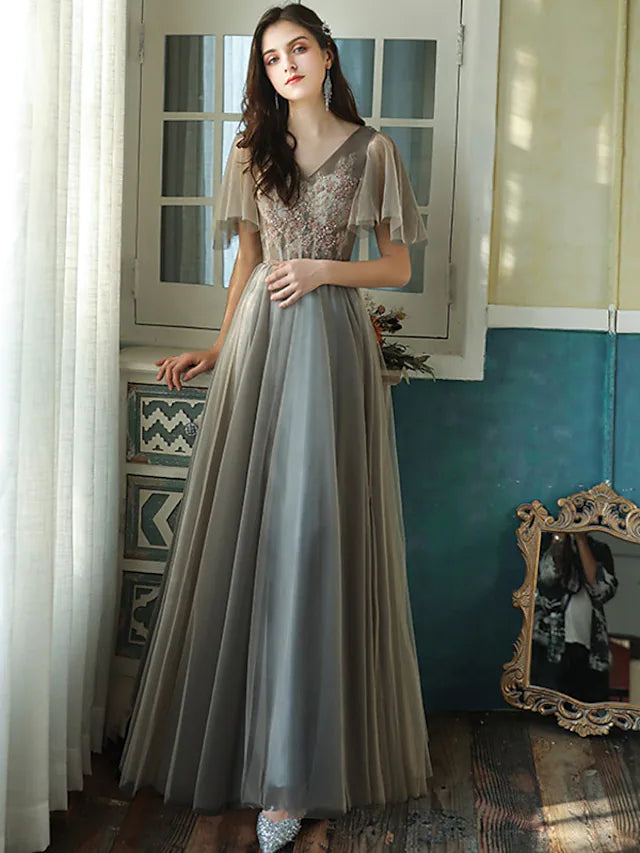 Elegant A-Line V-neck short sleeve bridesmaid dress with beading and sequin details.