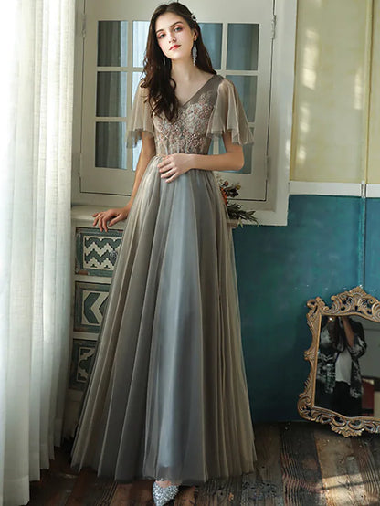 Elegant A-Line V-neck short sleeve bridesmaid dress with beading and sequin details.