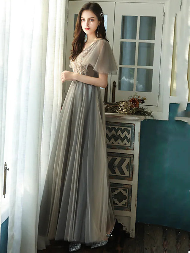 Side view of an elegant A-Line floor-length tulle bridesmaid dress.