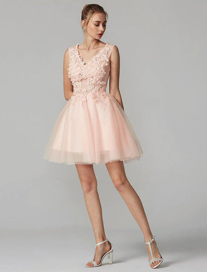 Back view of a sleeveless mini dress showing tulle skirt and V-neck on a model.