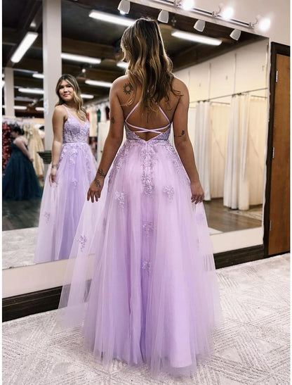 Side view of model in light blue A-line formal dress with slit.