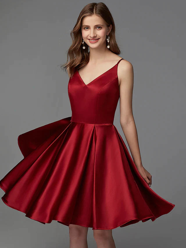 Model wearing an elegant A-line V-neck sleeveless pleated satin mini dress.