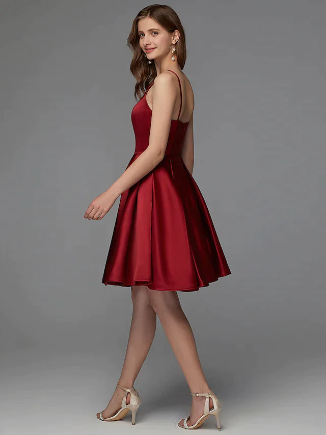 Close-up of the pleated satin fabric of the A-line mini dress.