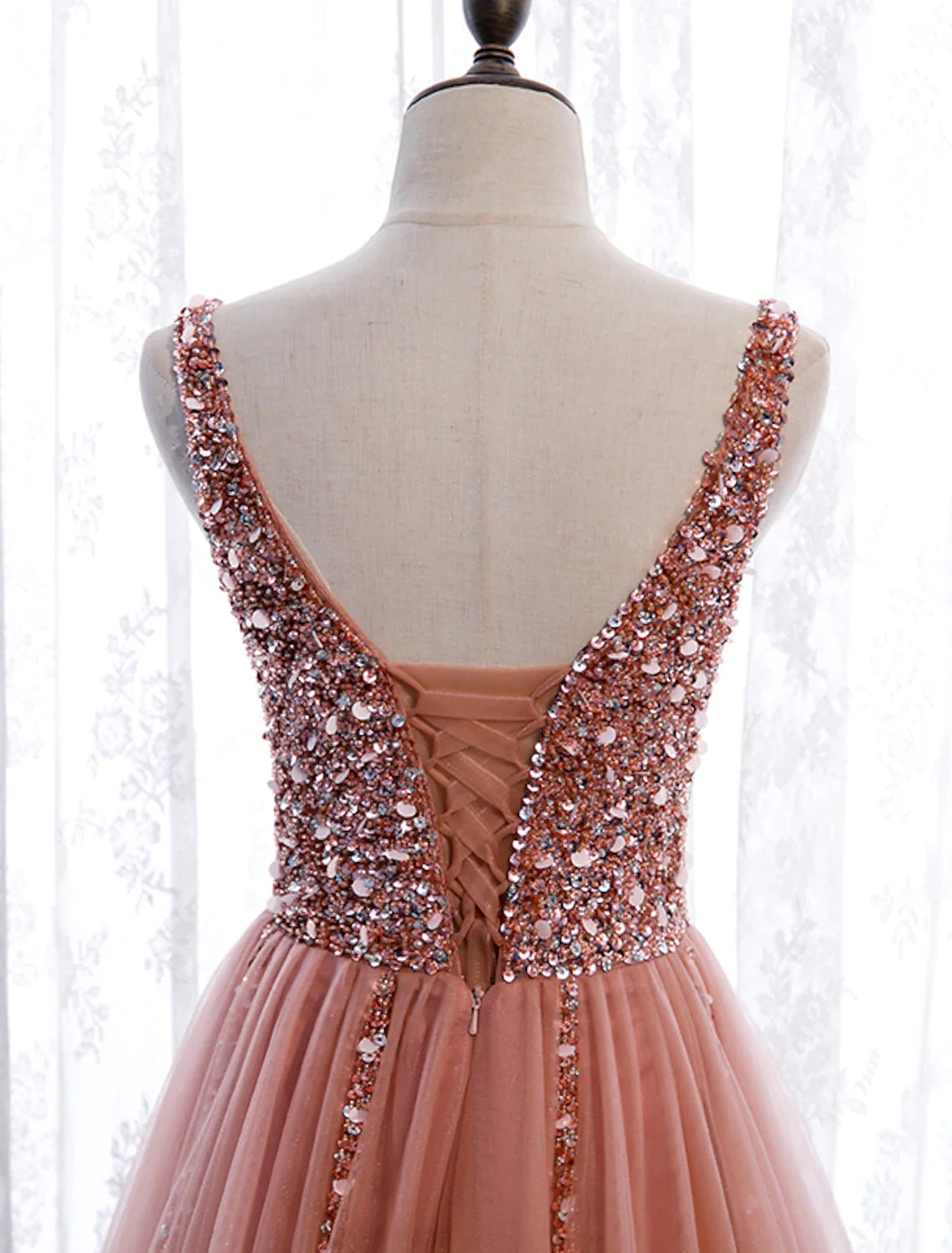 Back view of the elegant A-line prom dress, showcasing the court train and delicate pearl details.