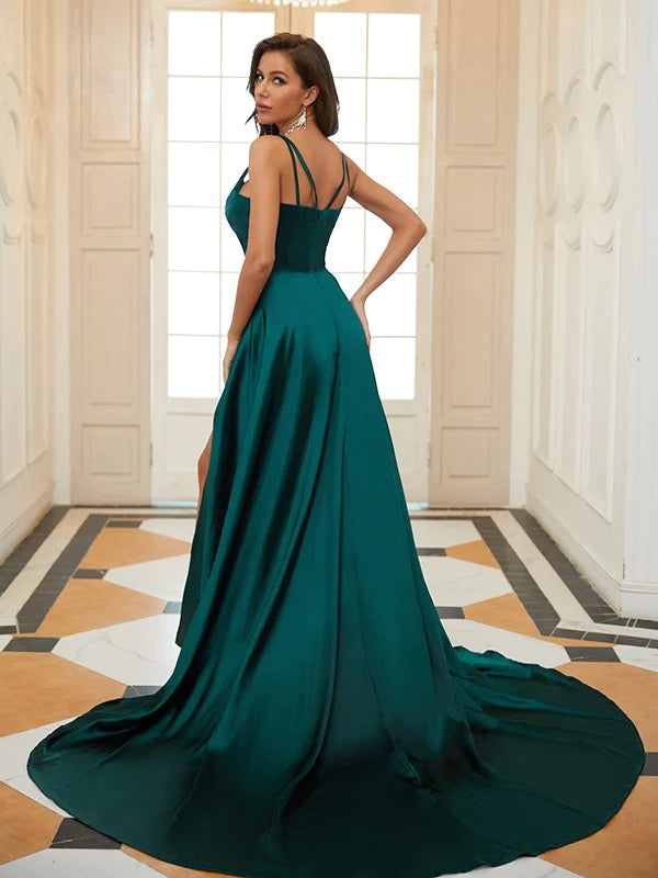 Back view of woman in A-line V-neck ruffled satin prom dress, showcasing the flowing court train.