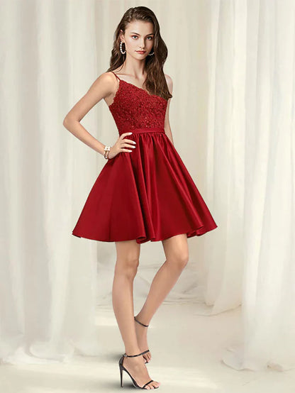 Woman wearing an A-line V-neck spaghetti strap short mini lace satin dress with pleats.