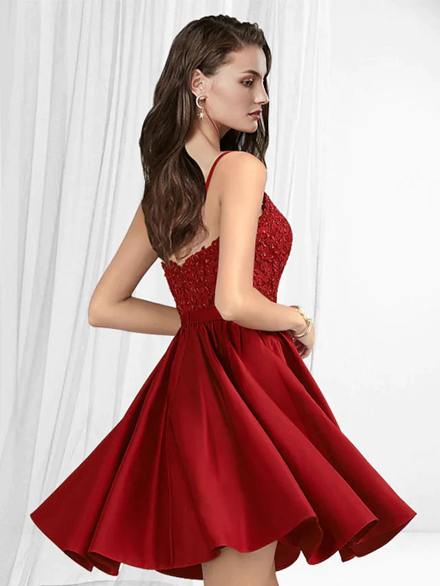 Side view of a woman in an A-line V-neck spaghetti strap short mini lace satin dress.