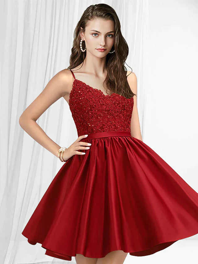 Back view of a woman in an A-line V-neck spaghetti strap short mini lace satin dress.