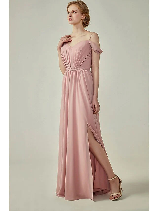 Back view of a light blue A-line chiffon bridesmaid dress with delicate spaghetti straps.