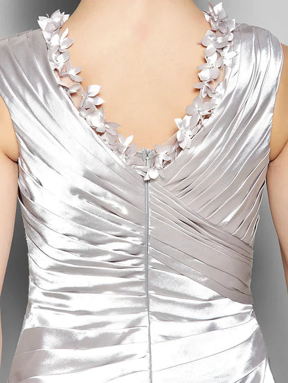 Woman posing gracefully in the sleeveless A-line formal gown.