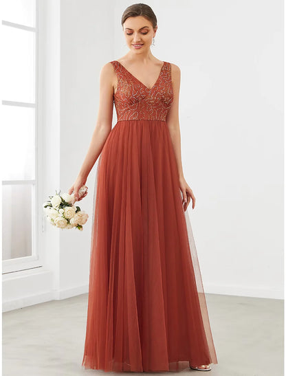 Woman wearing an elegant A-Line V-Neck tulle prom dress with draping details.