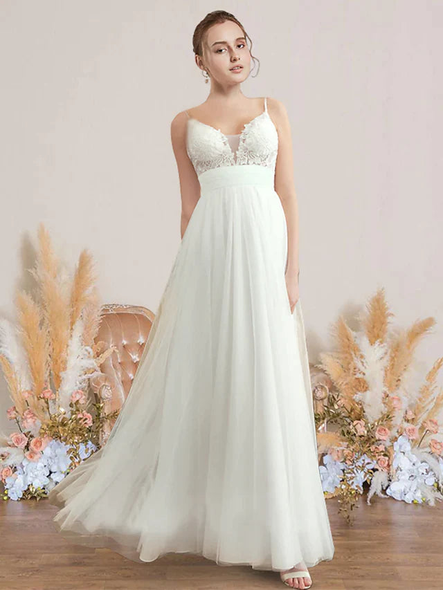 A-Line V-neck wedding dress with spaghetti straps, chiffon, lace, and pleats on a model.