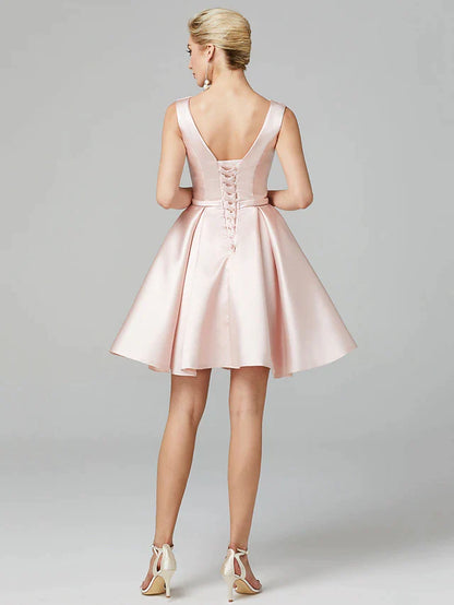 Back view of a pleated A-line satin knee-length dress.