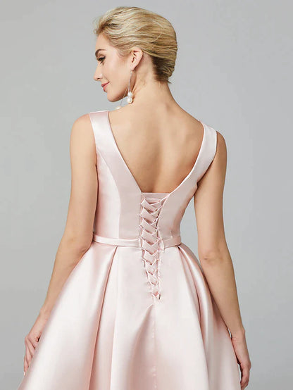 Full view of a knee-length A-line satin dress with pleats.