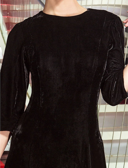Side profile of the A-line velvet dress, highlighting the 3/4 sleeves and silhouette.
